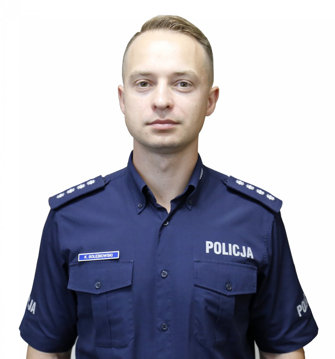 wizerunek oficera prasowego komisarza Kamila Gołębiowskiego w umundurowaniu 